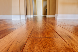 Sanding and waxing of a solid wood flooring